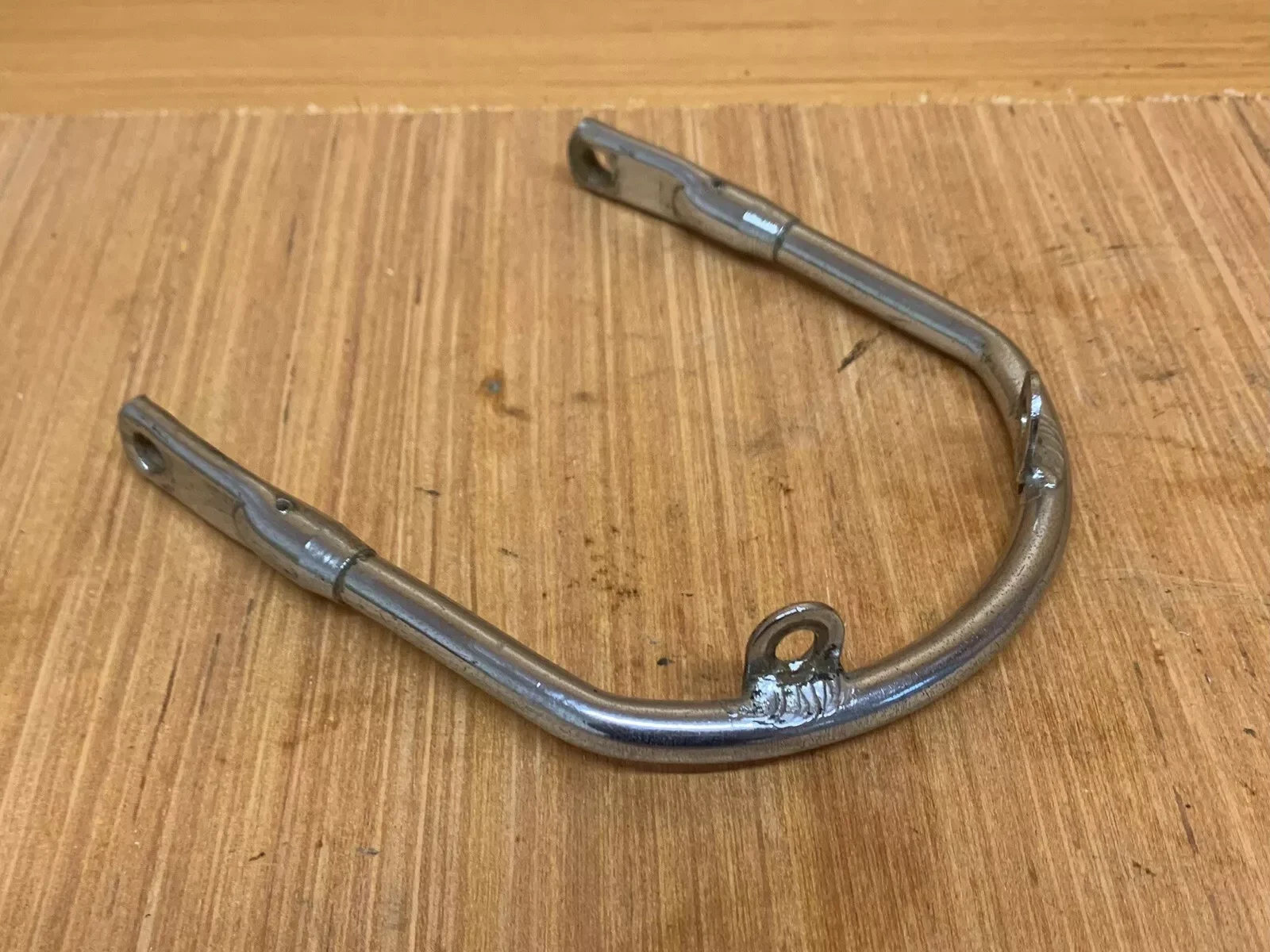 TRIUMPH T140 SHORT FRONT MUDGUARD BRACKET CHROME (USED GOOD CONDITION)